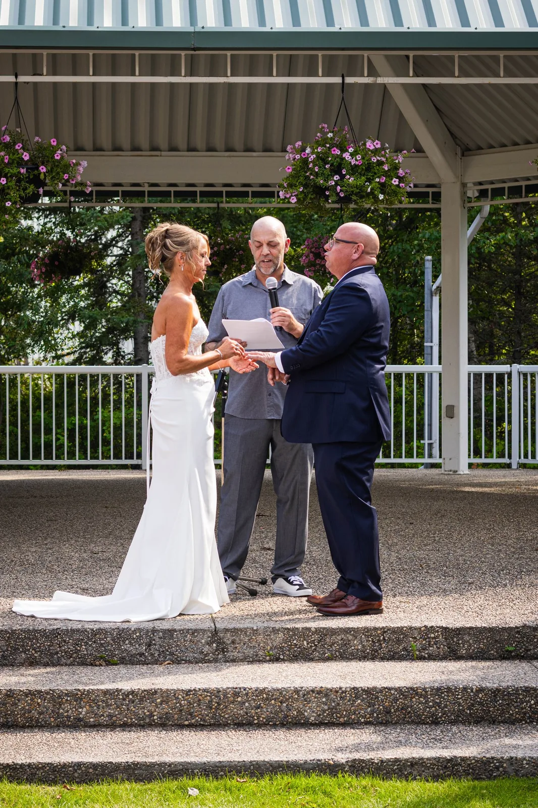 A couple at the altar during an outdoor wedding at Clymont
