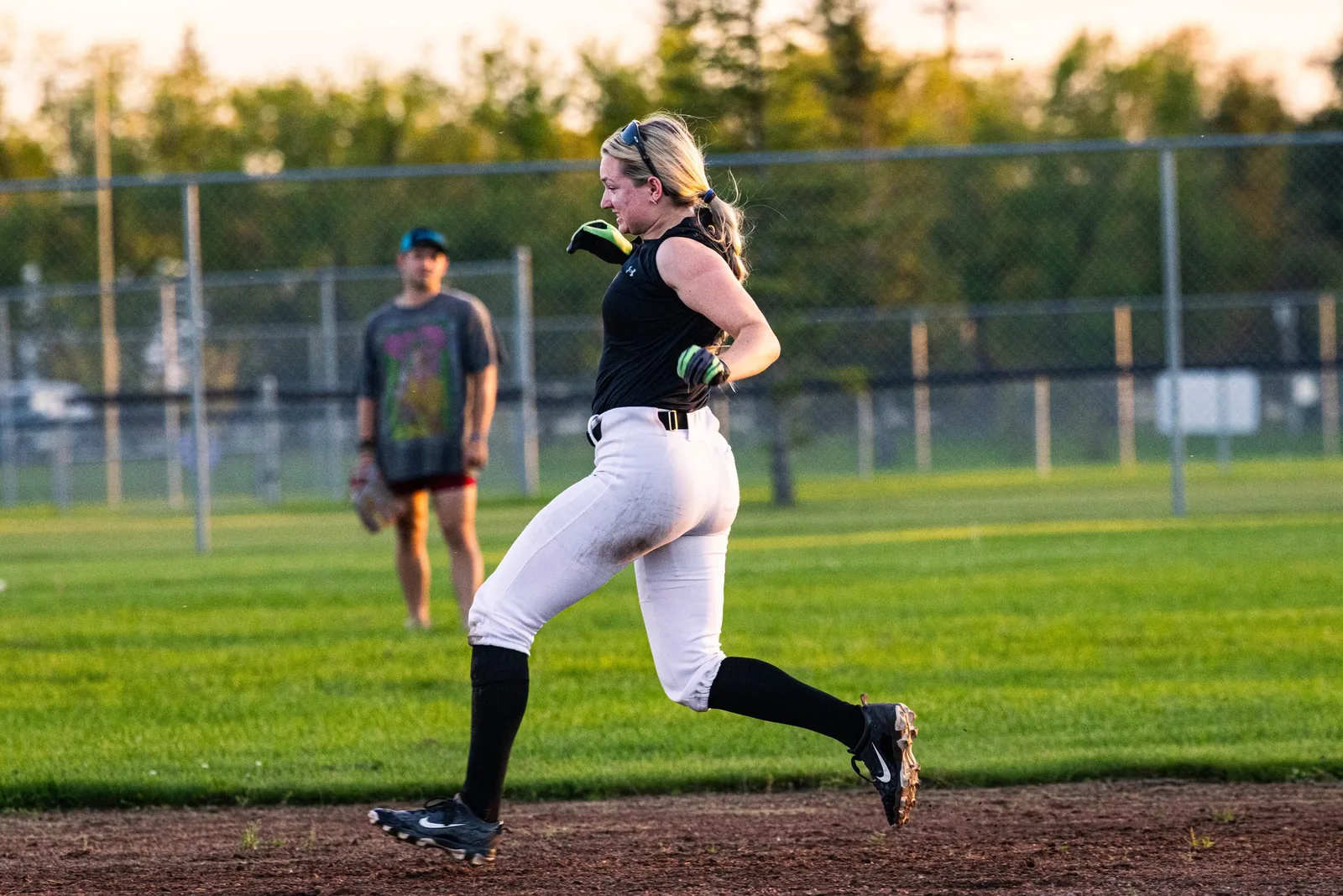 A runner rounding the bases at Funball