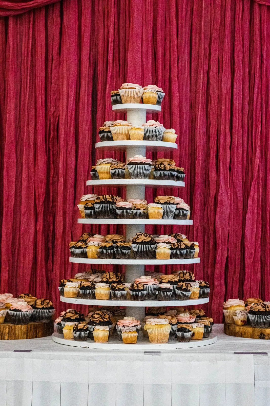 A tiered cupcake display at a wedding reception